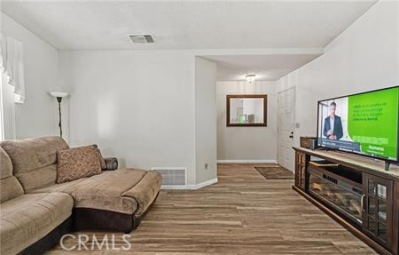 2906 Summer Set Circle Banning, CA 92220 - Photo 3 of 38 a living room with furniture and a flat screen tv