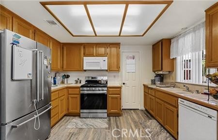 2906 Summer Set Circle Banning, CA 92220 - Photo 7 of 38 a kitchen with stainless steel appliances granite countertop a sink stove and refrigerator