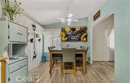 2906 Summer Set Circle Banning, CA 92220 - Photo 9 of 38 a view of a dining room with furniture and wooden floor