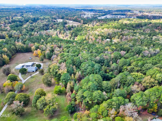 an aerial view of multiple house with yard
