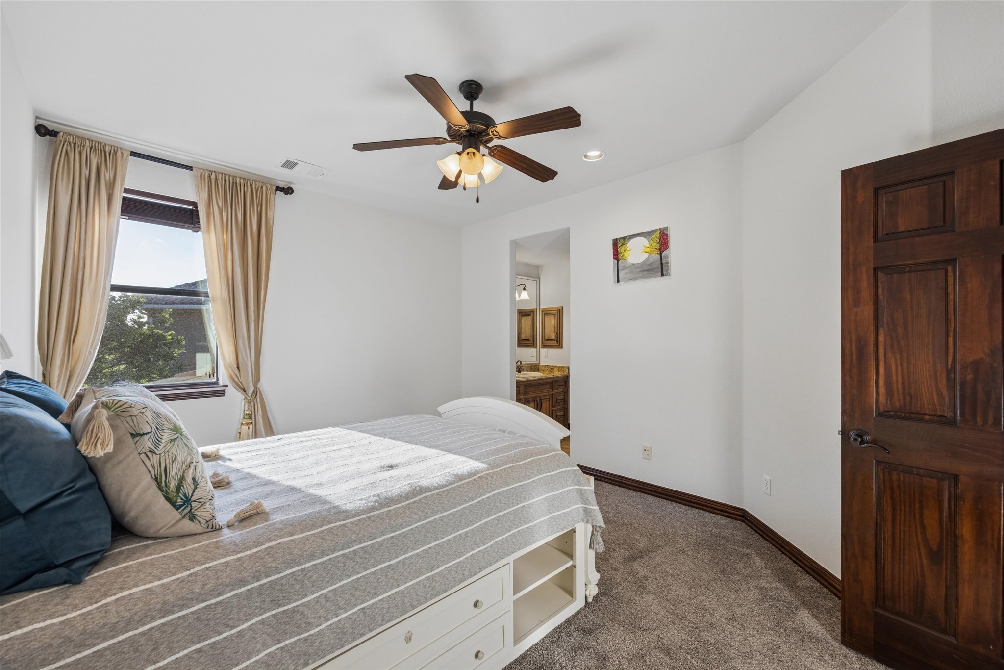 11805 Ranchview Court Austin, TX 78732 - Photo 23 of 36 Bedroom featuring a ceiling fan with integrated lighting, recessed lighting, and carpet flooring