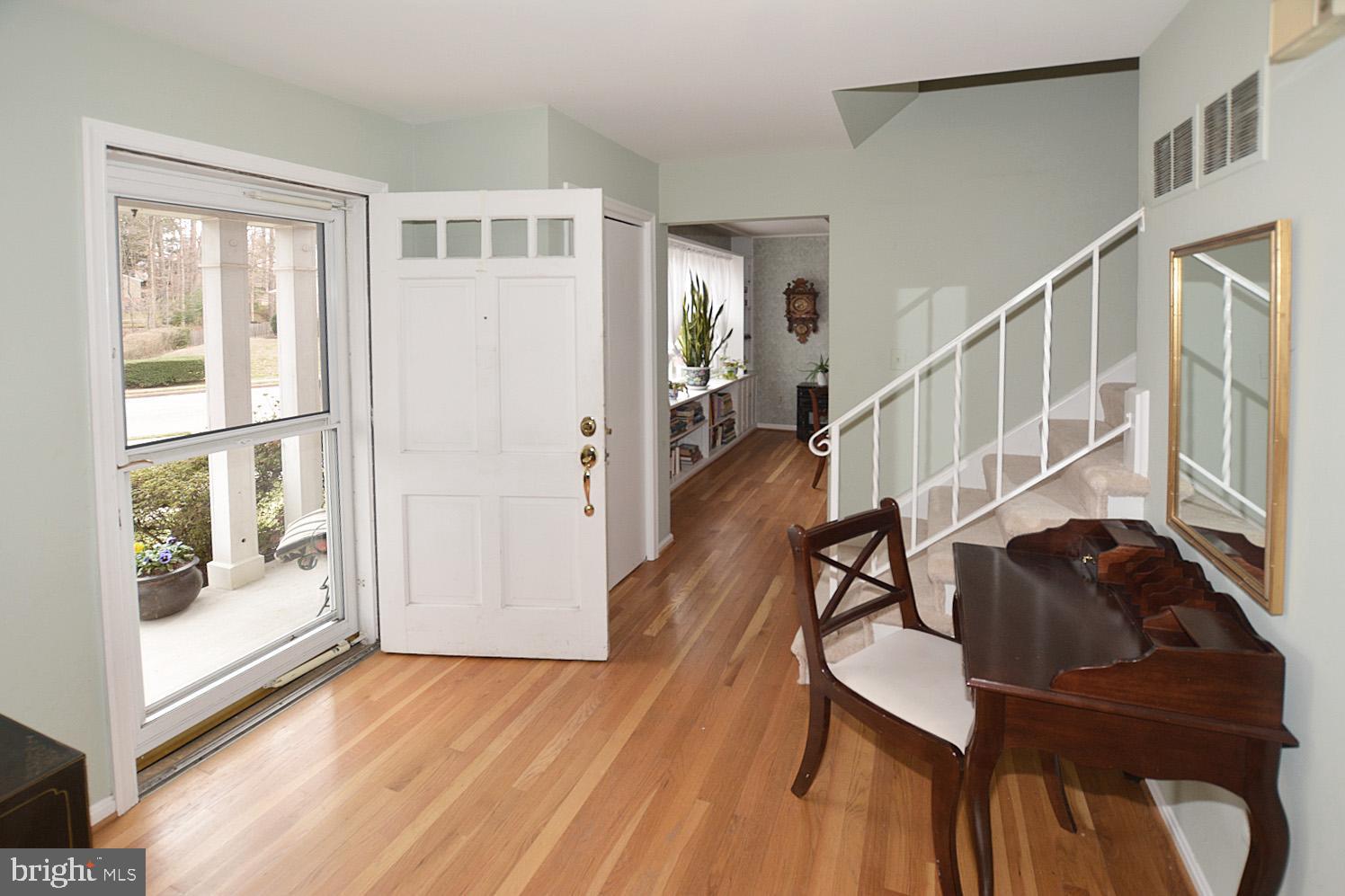 6906 Spur Road Springfield, VA 22153 - Photo 2 of 28 a view of entryway and hall with wooden floor
