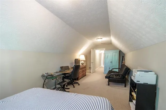 a view of a room with table and chairs