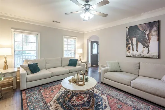 a view of a dining room with furniture wooden floor and a window