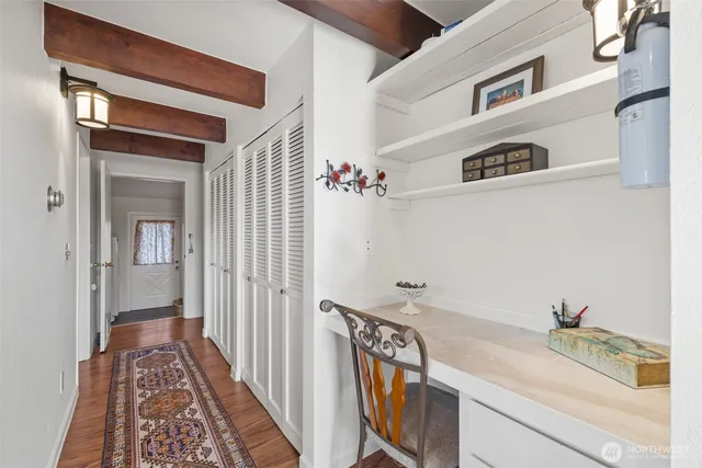 a bathroom with a granite countertop sink and a shower curtain