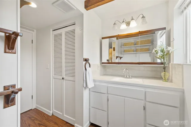 a bathroom with a sink and a mirror