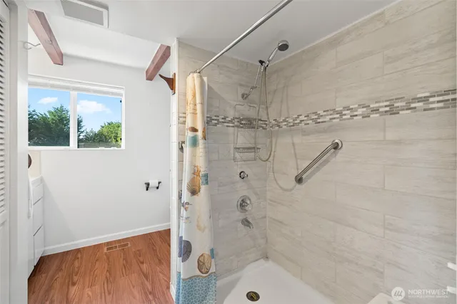 a bathroom with a shower and a toilet