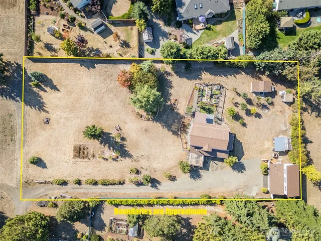 an aerial view of a house with a swimming pool
