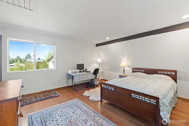 a bed room with a bed and a window