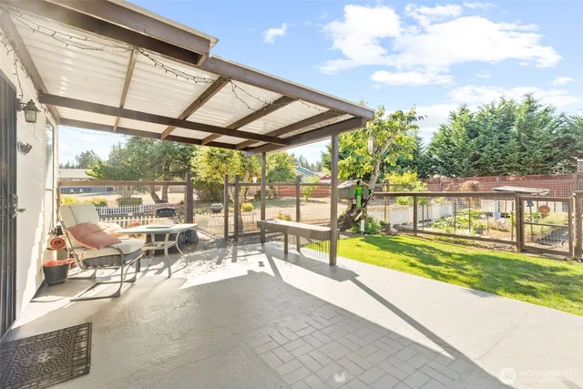 a view of a swimming pool with an outdoor seating