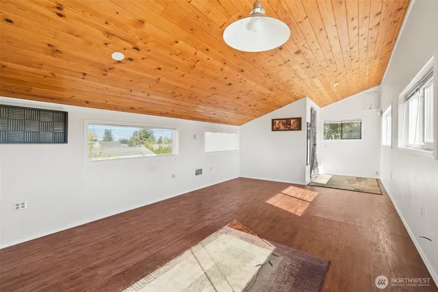 a view of a livingroom with wooden floor