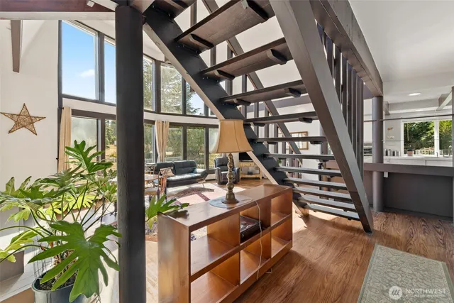 a view of an entryway with wooden floor and door