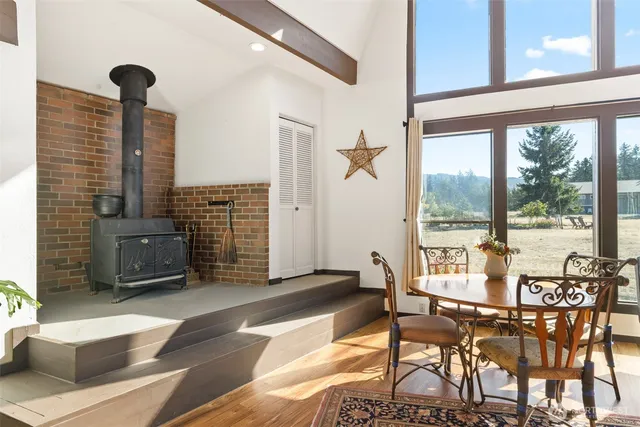 a view of a dining room with furniture window and outside view