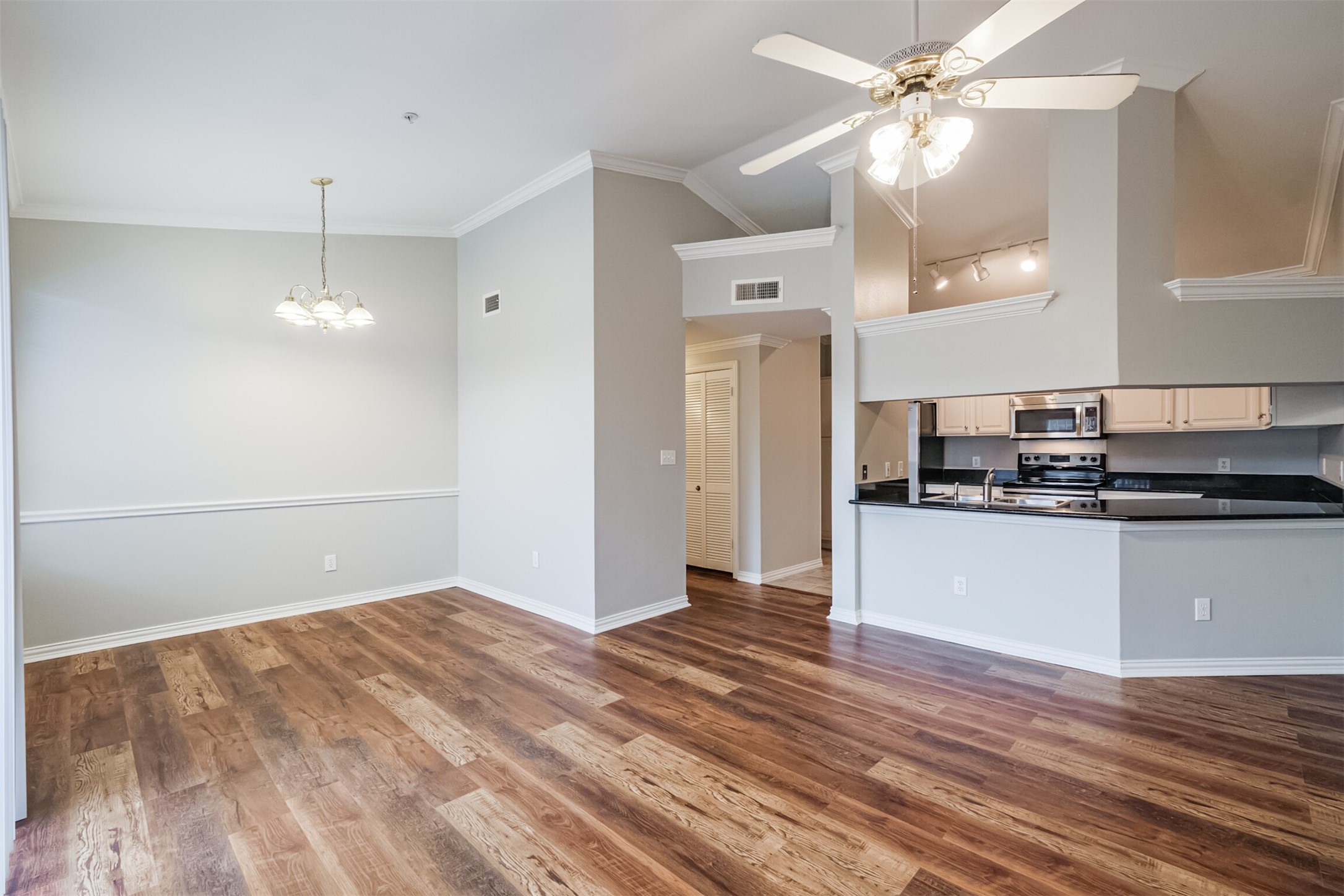 2111 Welch Street, Unit B304 Houston, TX 77019 - Photo 2 of 37 a view of a kitchen with a dishwasher cabinets and wooden floor