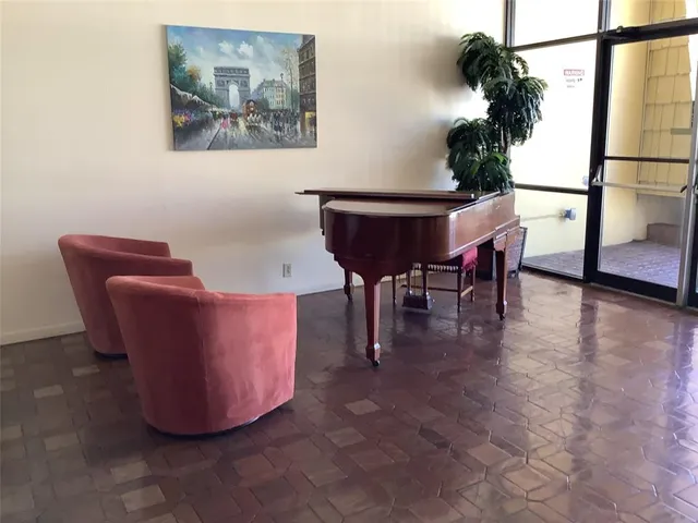 a view of a swimming pool with outdoor seating