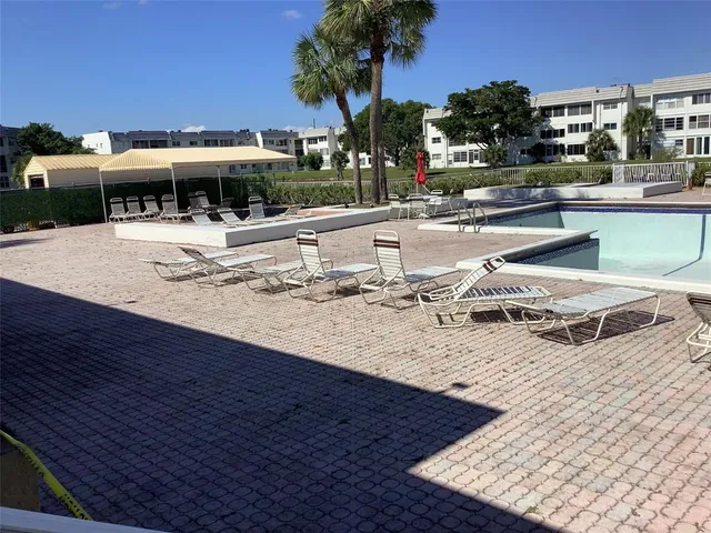 a outdoor space with swimming pool and furniture