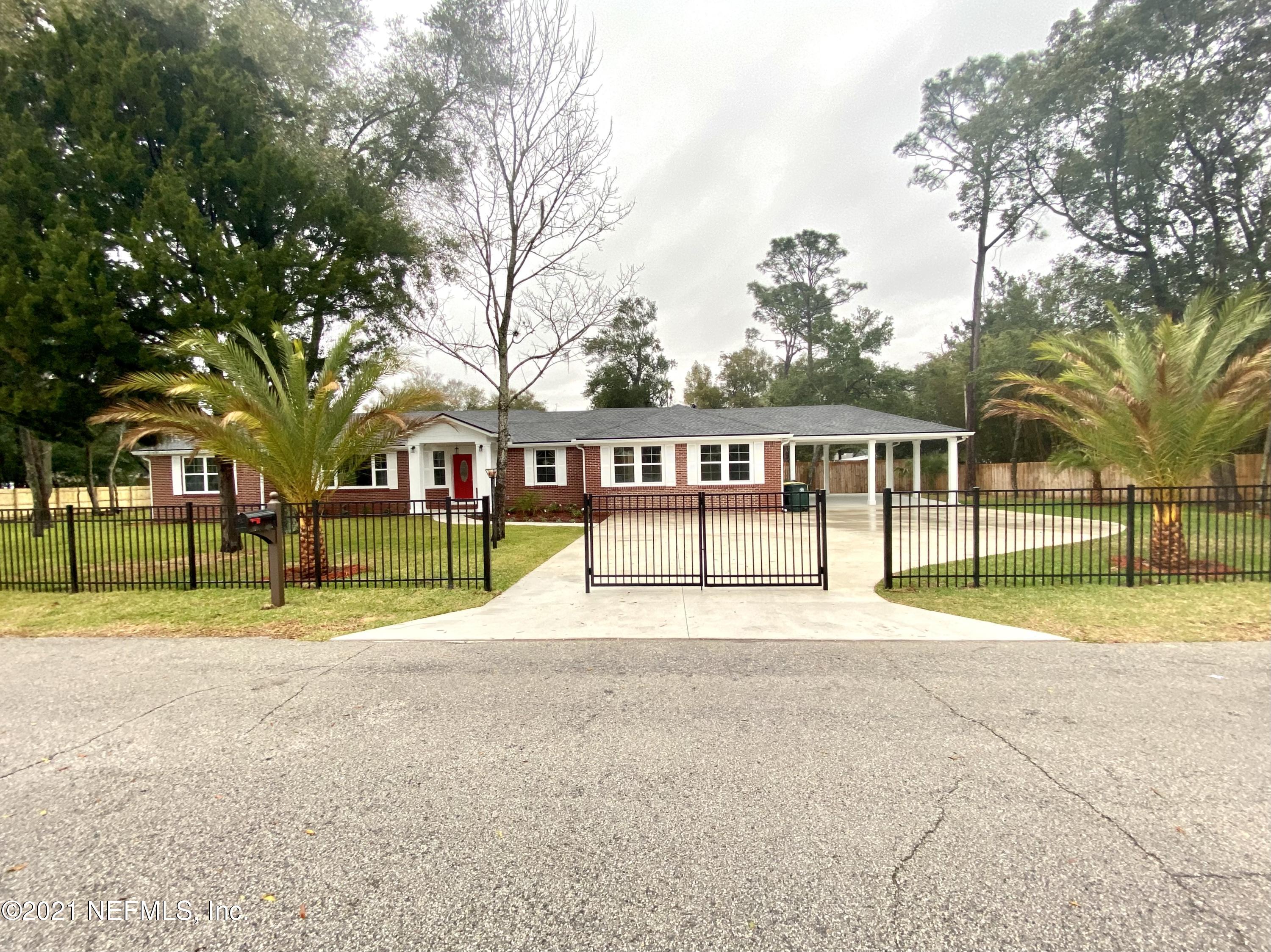 9709 Lily Road Jacksonville, FL 32246 - Photo 1 of 60 a view of swimming pool with trees in front of it