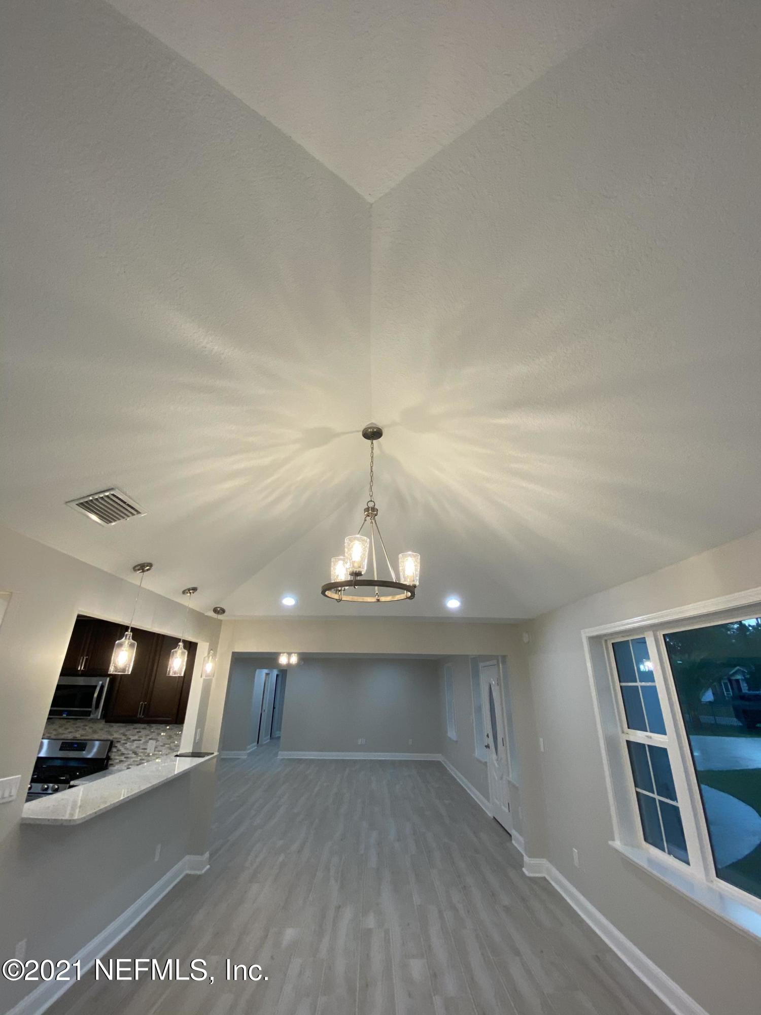 9709 Lily Road Jacksonville, FL 32246 - Photo 15 of 60 a view of a livingroom with furniture and wooden floor
