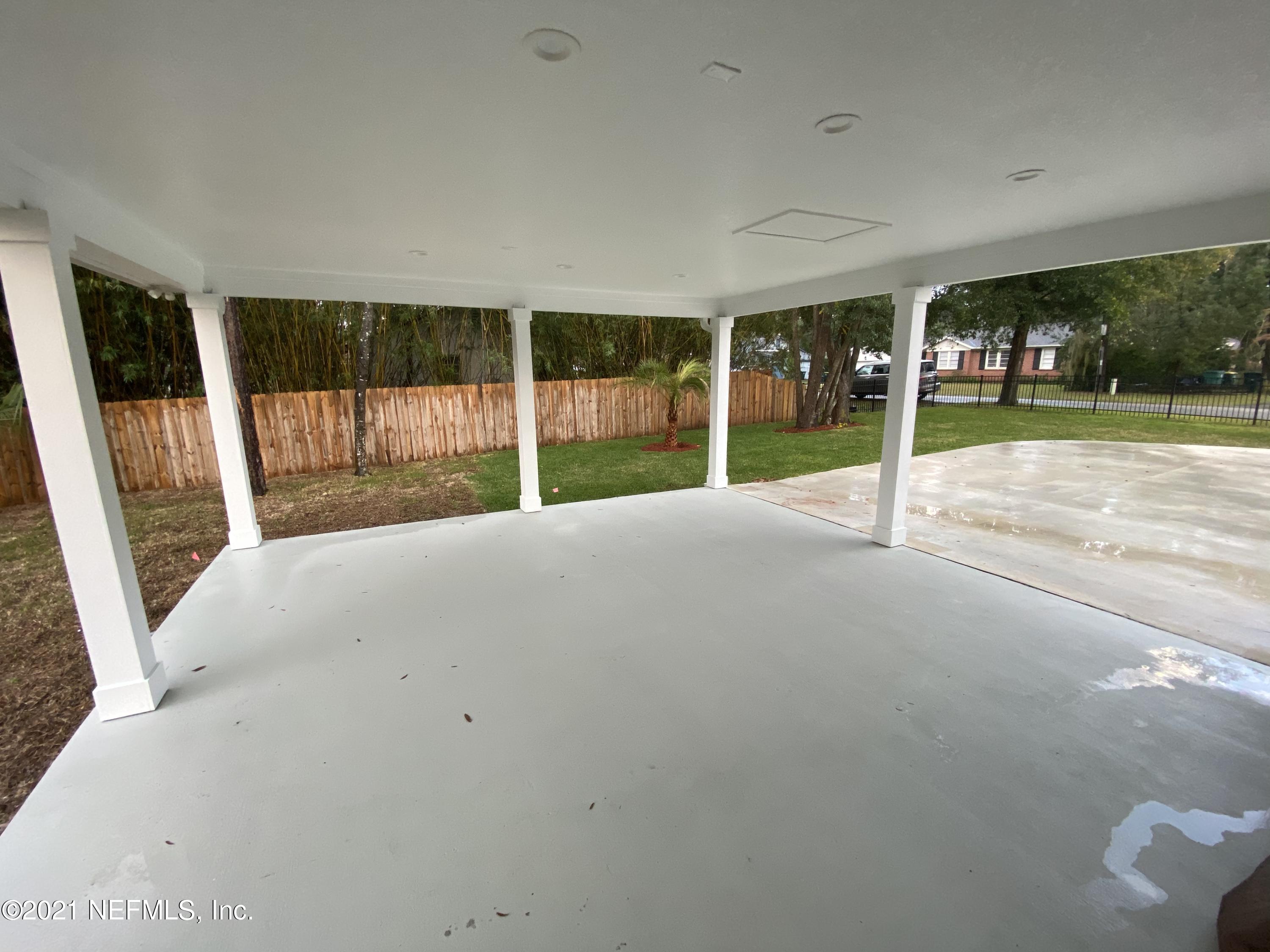 9709 Lily Road Jacksonville, FL 32246 - Photo 53 of 60 a view of an empty room with a balcony