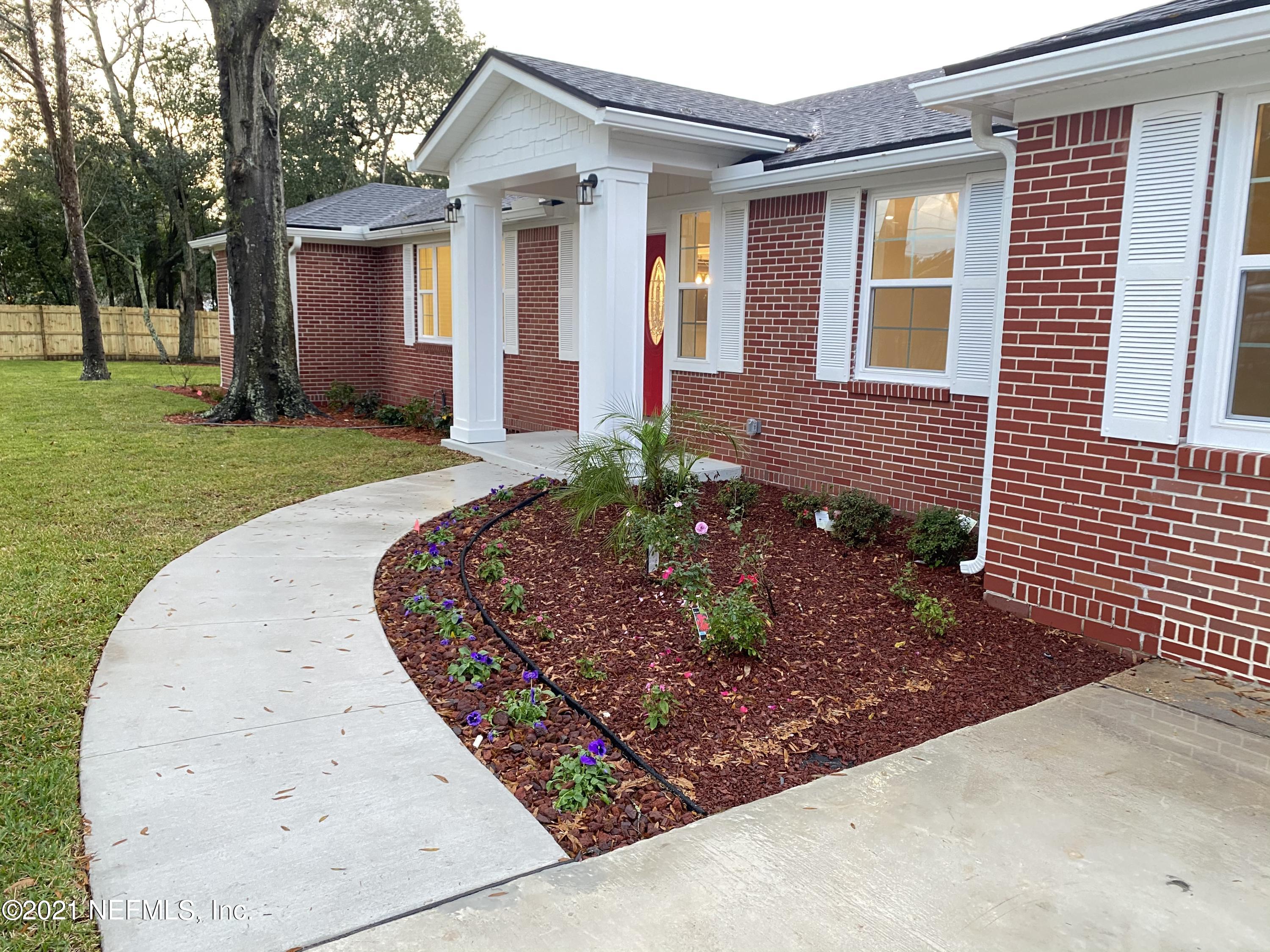 9709 Lily Road Jacksonville, FL 32246 - Photo 54 of 60 front view of a house with a yard