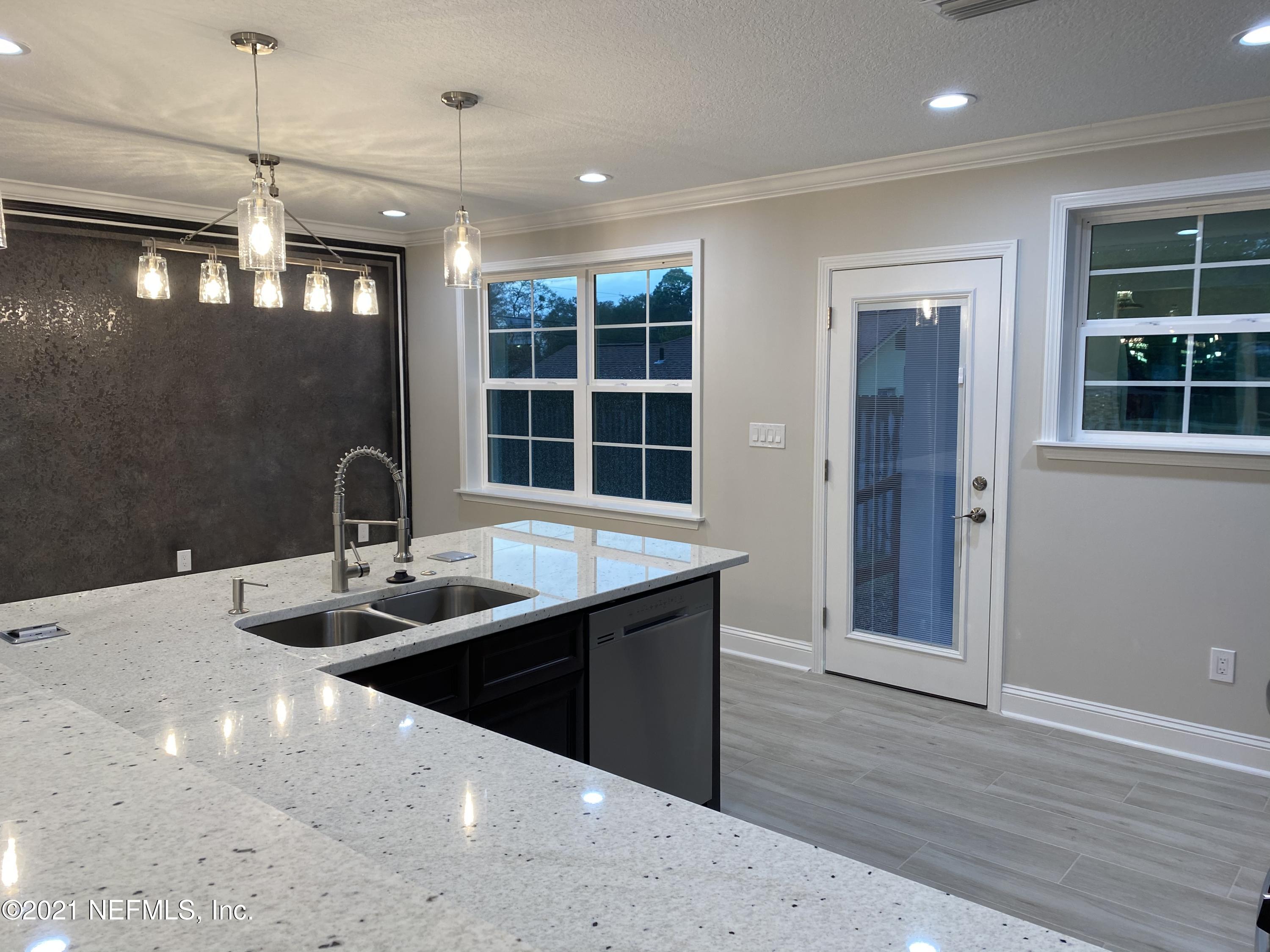 9709 Lily Road Jacksonville, FL 32246 - Photo 8 of 60 a kitchen with sink and window