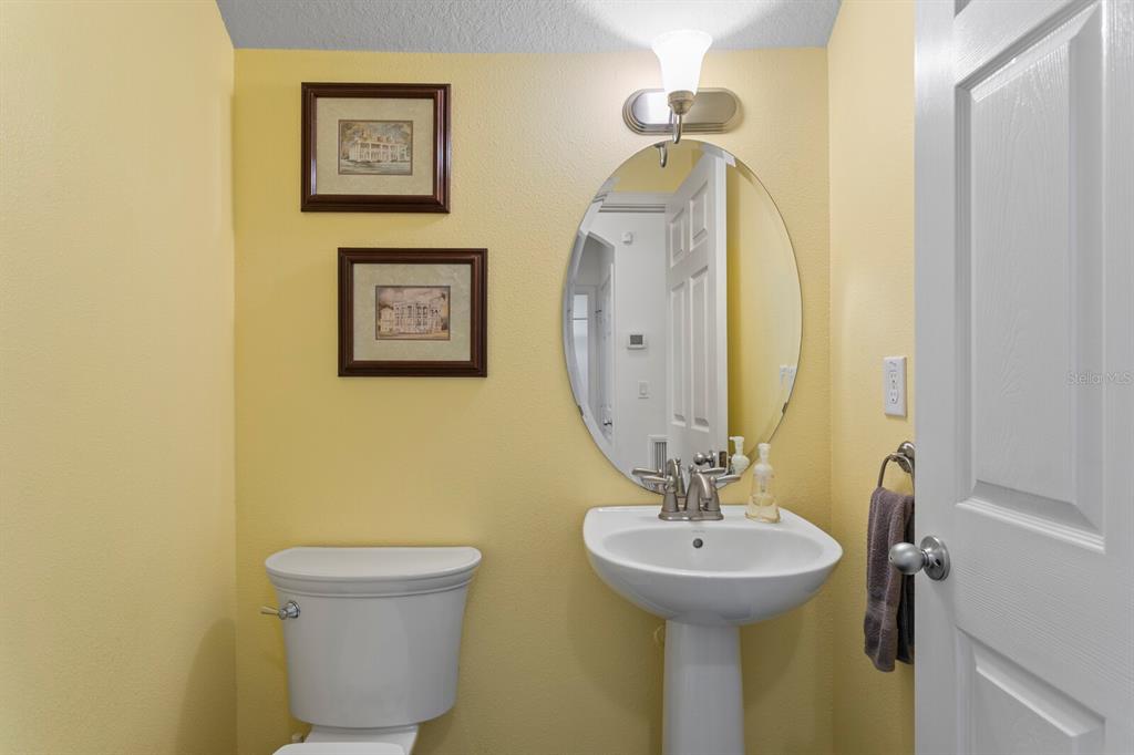 2839 Maple Brook Loop Lutz, FL 33558 - Photo 24 of 61 a bathroom with a sink and a mirror