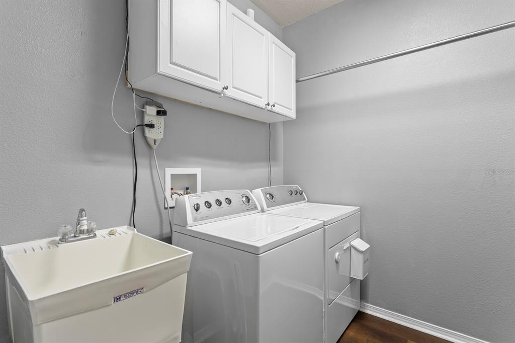 2839 Maple Brook Loop Lutz, FL 33558 - Photo 25 of 61 a utility room with dryer and washer