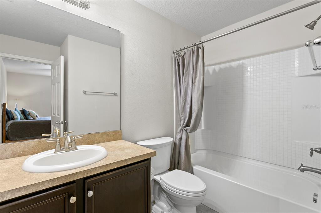 2839 Maple Brook Loop Lutz, FL 33558 - Photo 34 of 61 a bathroom with a sink toilet and shower