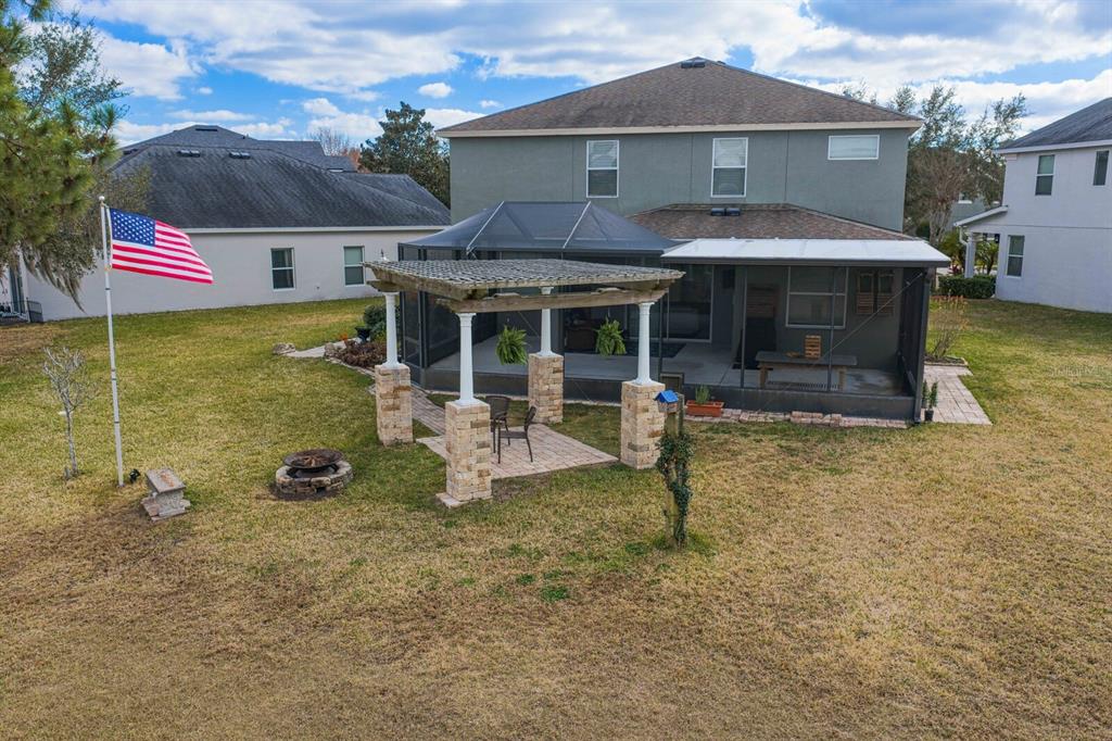 2839 Maple Brook Loop Lutz, FL 33558 - Photo 39 of 61 a view of a white house with a sink and a yard