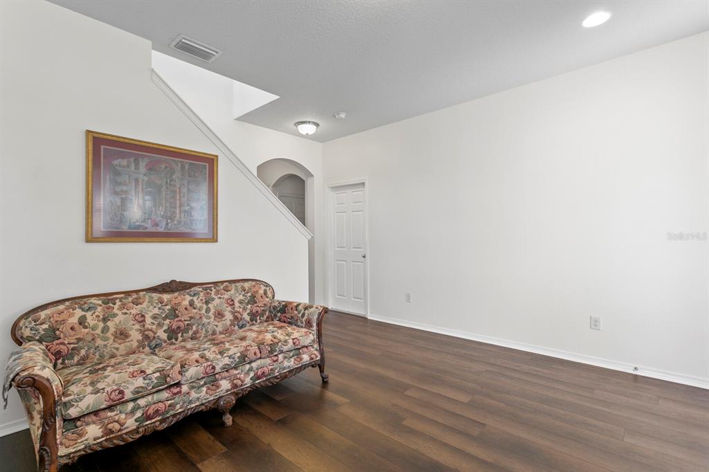 2839 Maple Brook Loop Lutz, FL 33558 - Photo 6 of 61 a bedroom with a bed and a couch