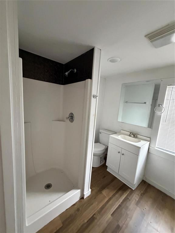 2240 Pin Oak Circle Haughton, LA 71037 - Photo 9 of 9 Full bath with vanity, a stall shower, and dark wood-style flooring