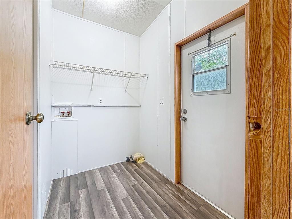 1819 Sinclair Hills Road Lutz, FL 33549 - Photo 51 of 60 a view of a hallway with wooden floor and closet