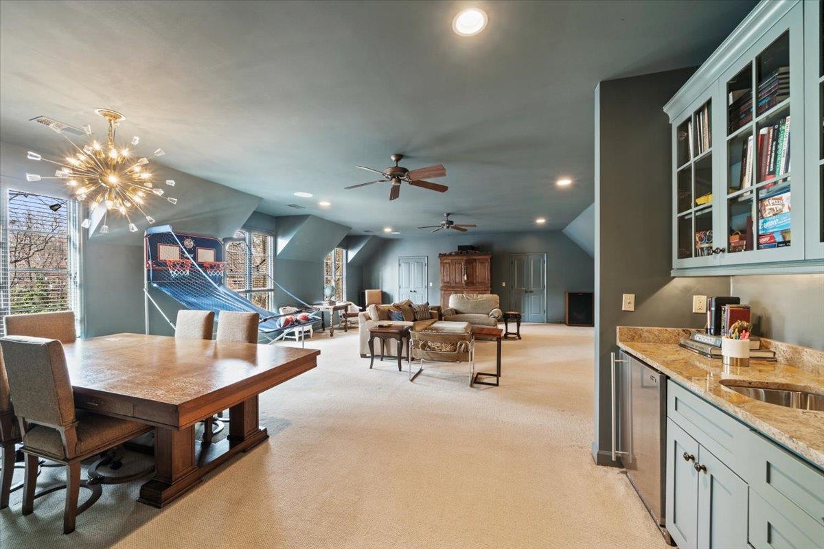 4565 Normandy Road Memphis, TN 38117 - Photo 28 of 40 a living room with furniture and a chandelier