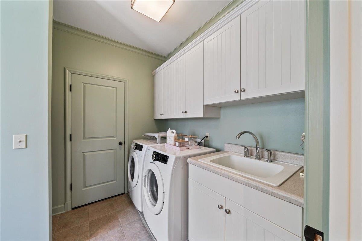 4565 Normandy Road Memphis, TN 38117 - Photo 34 of 40 a view of a storage and utility room with washer and dryer