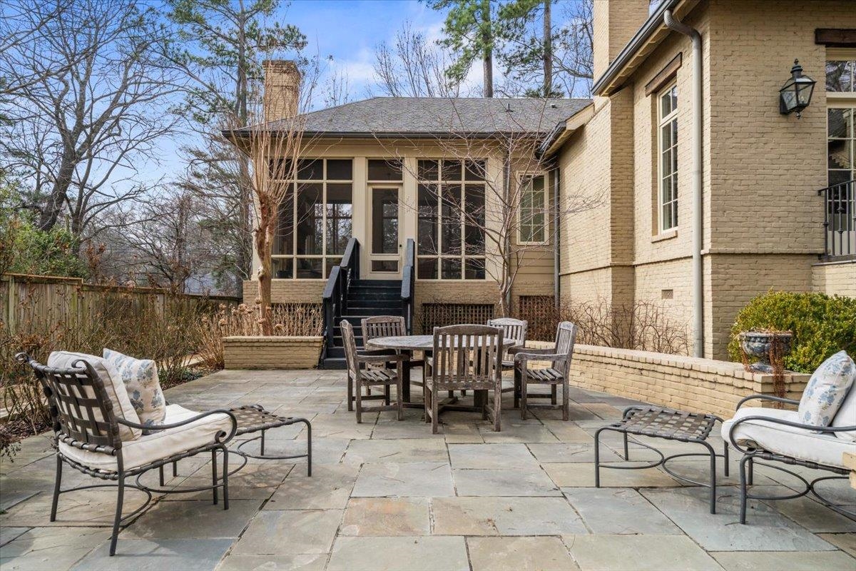 4565 Normandy Road Memphis, TN 38117 - Photo 36 of 40 a view of a patio with couches table and chairs and potted plants