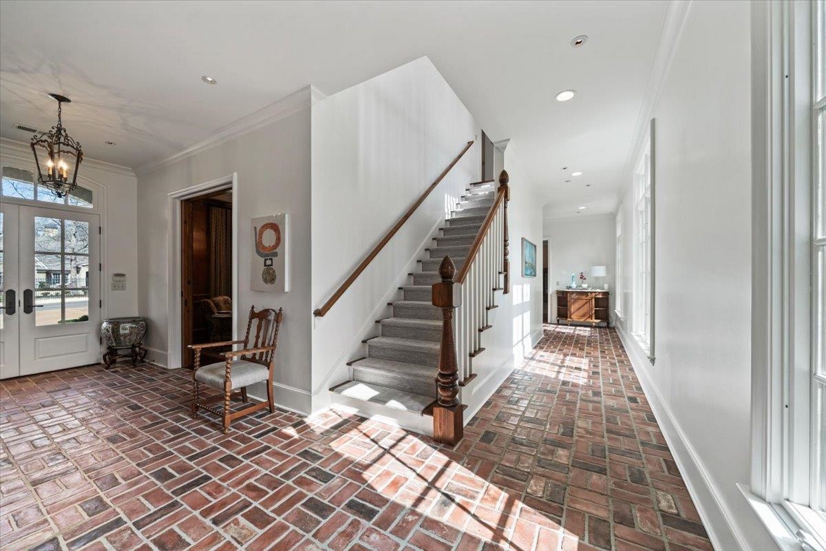 4565 Normandy Road Memphis, TN 38117 - Photo 4 of 40 a view of a hallway with wooden floor and staircase