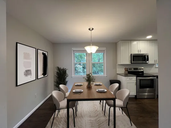 a view of a dining room with furniture window and outside view