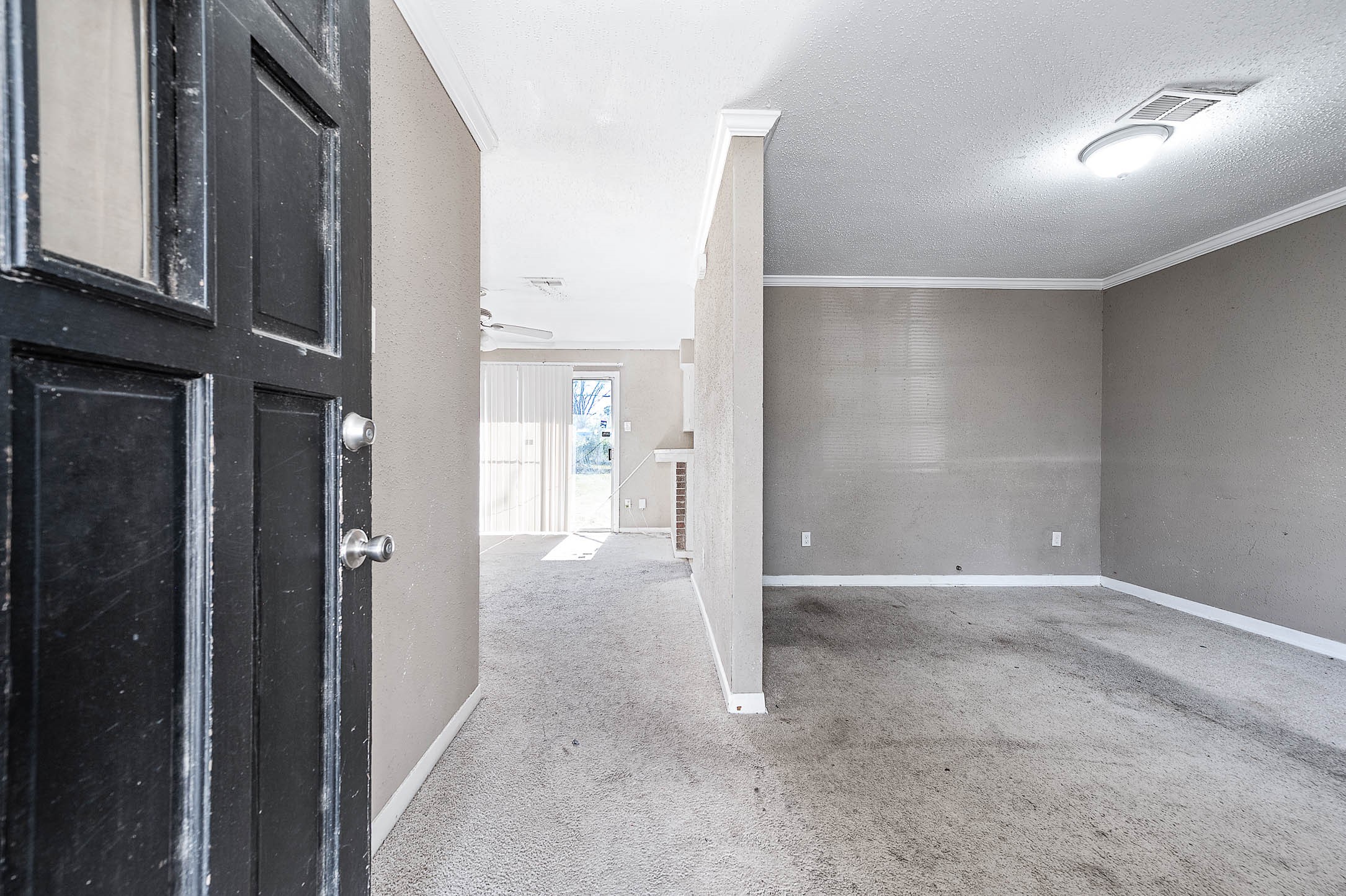 6110 Guadalupe Street Houston, TX 77016 - Photo 2 of 24 a view of a hallway with wooden shelves