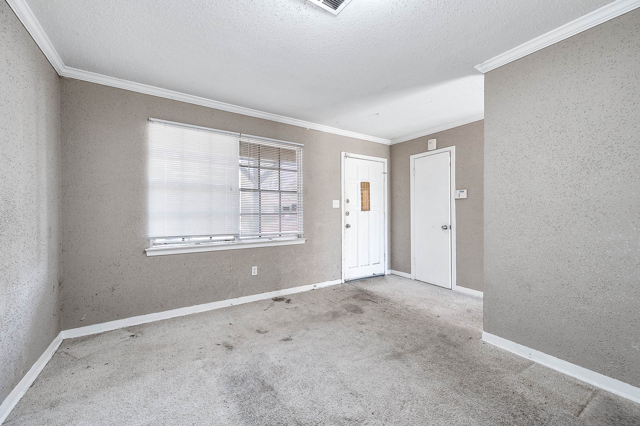 6110 Guadalupe Street Houston, TX 77016 - Photo 4 of 24 a view of an empty room with windows