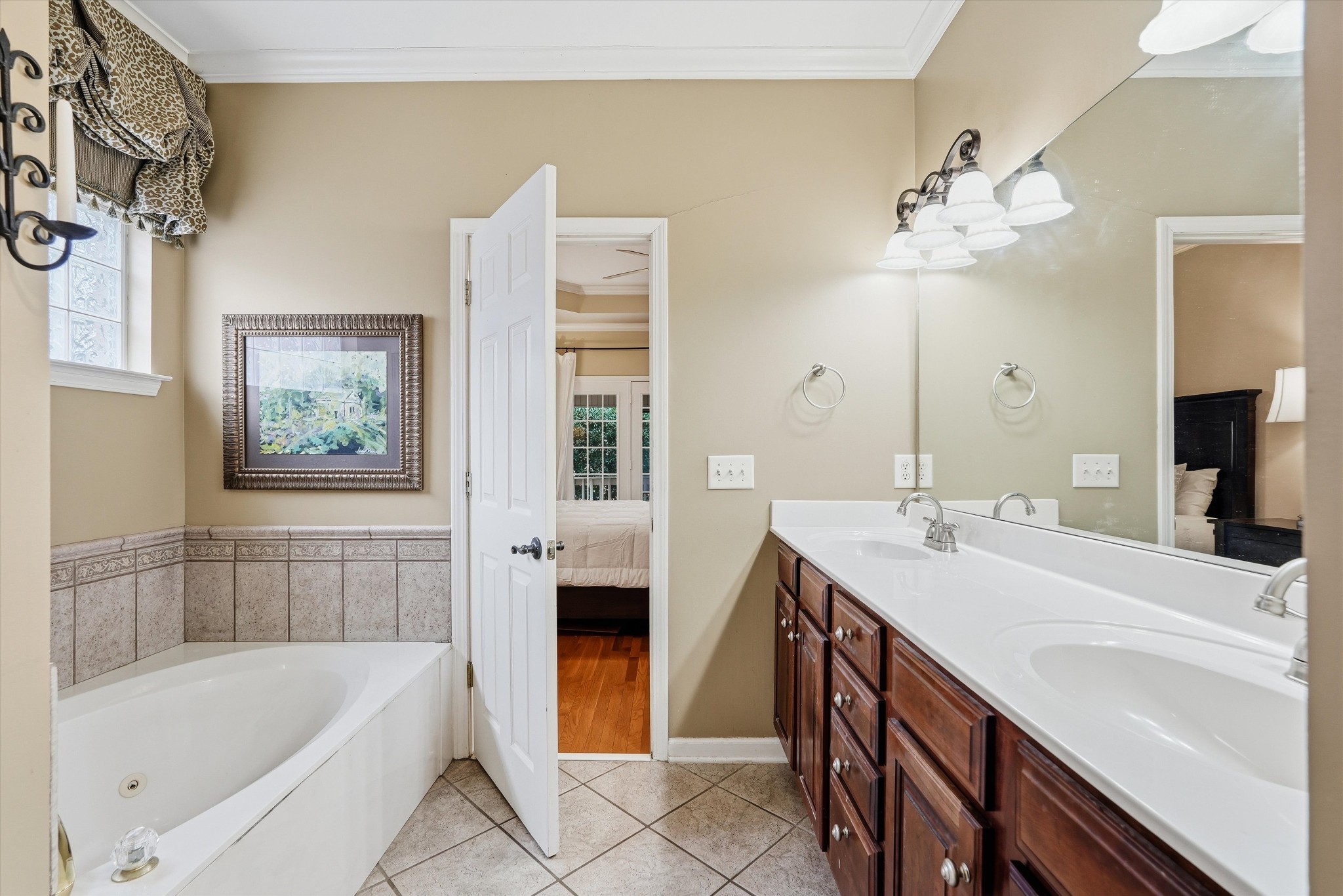 132 Windchase Run Hermitage, TN 37076 - Photo 22 of 38 a bathroom with a tub a sink and a mirror