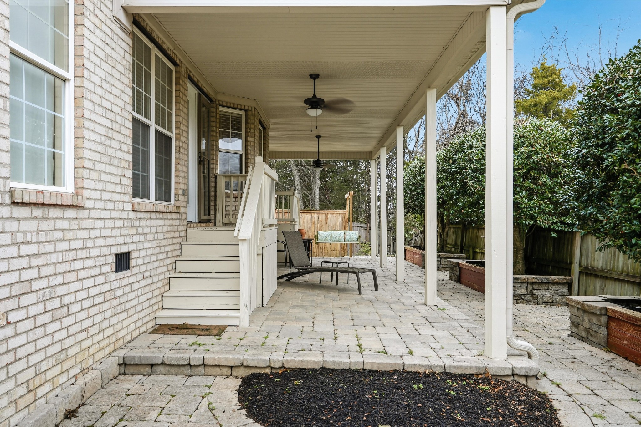 132 Windchase Run Hermitage, TN 37076 - Photo 34 of 38 a view of a patio with table and chairs and wooden fence