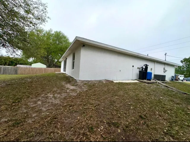a backyard of a house with lots of green space