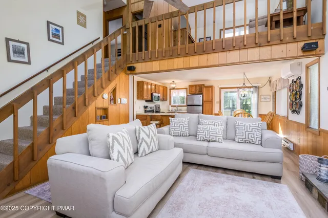 a living room with furniture or stairs and a couch