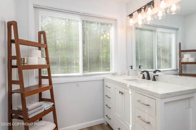 a kitchen with a sink and a window