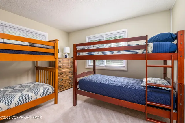 a bedroom with a bed and lamp