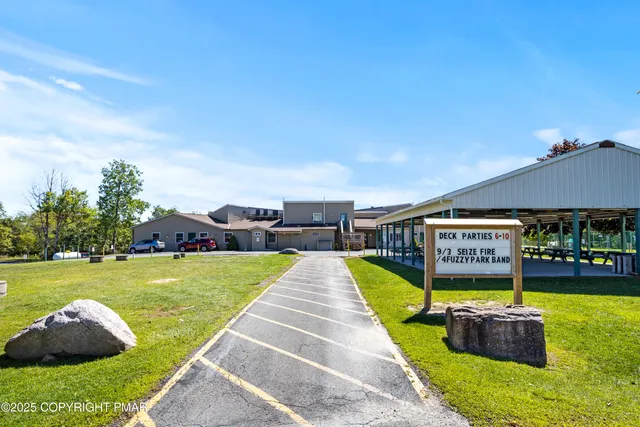 a view of a swimming pool with seating area