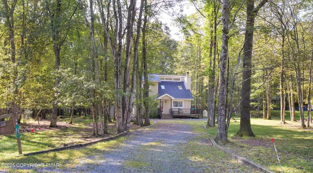 a front view of a house with a yard garden
