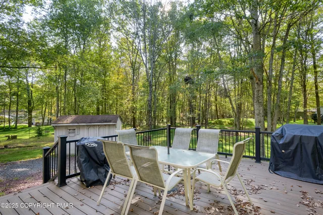a view of a table and chairs in the garden