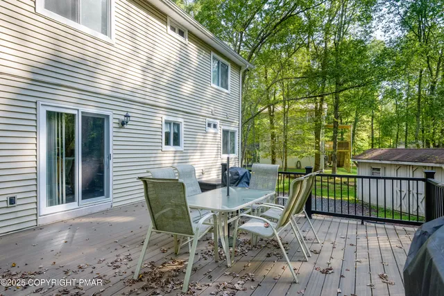 a view of a patio with a table and chairs
