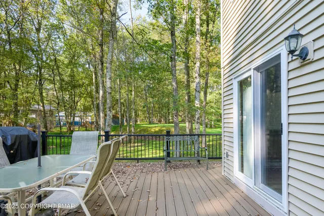 a view of a balcony with wooden floor
